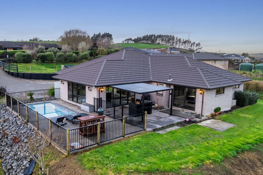 Aerial view of a completed pool, deck and landscaped section